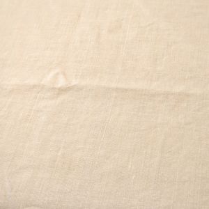 Tablecloth off-white linen 52x100" narrow beige satin trim on scalloped edge.